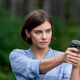 Maggie (Lauren Cohen), seen pointing a gun at a new character AMC didn’t bother to provide a photo of.